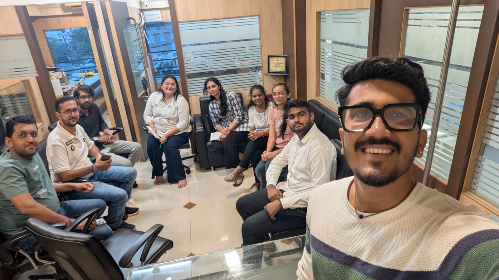 Group selfie with the whole team at the office